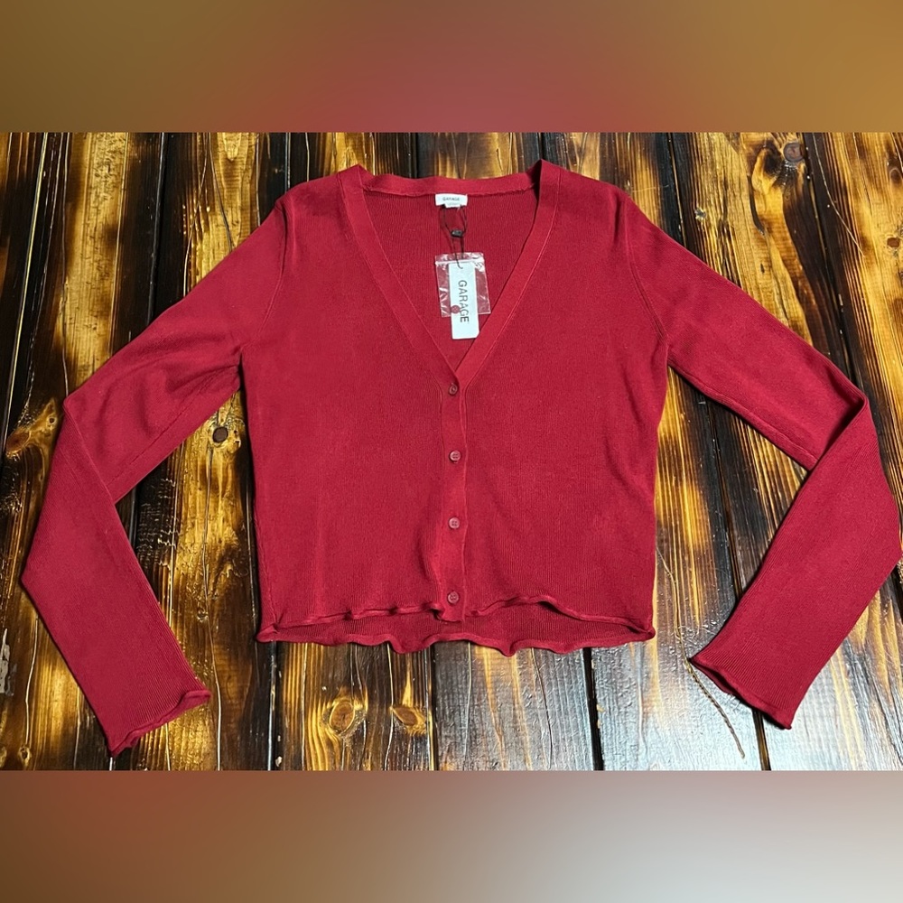 Red button down sweater.